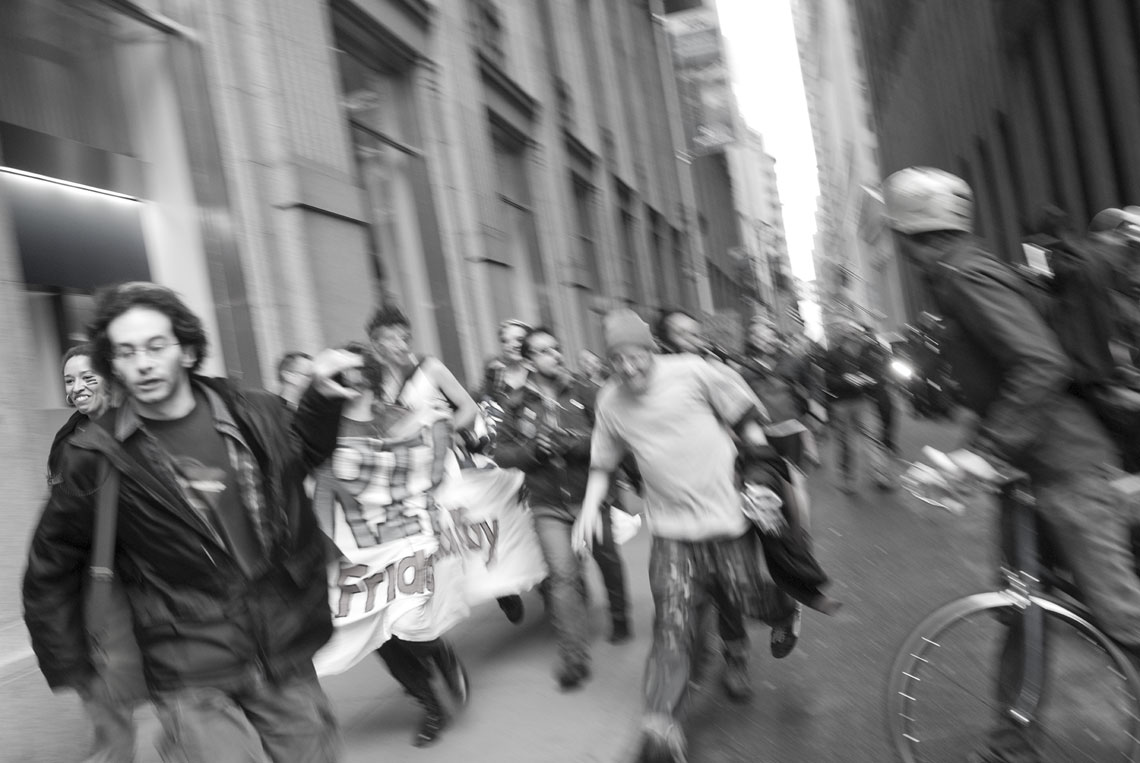 Occupy Wall Street protesters running from NYPD