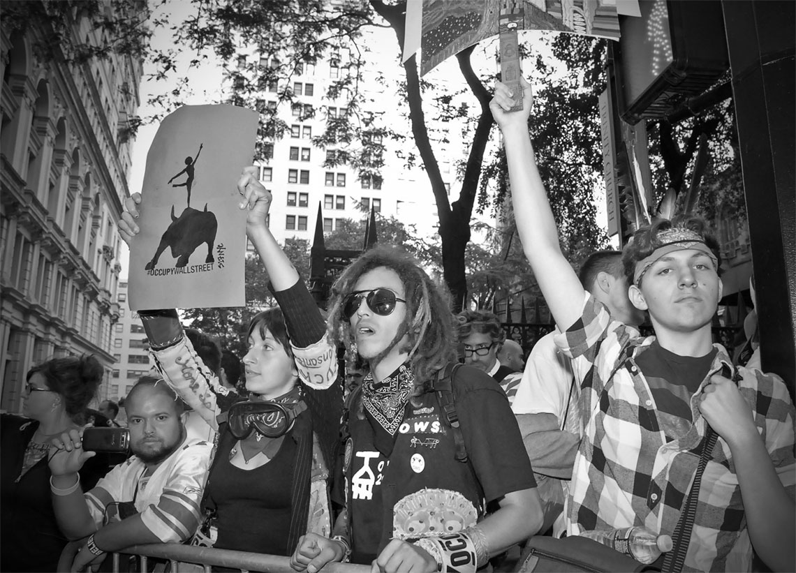 Occupy Wall Street Crowd Protesting Dredlock man